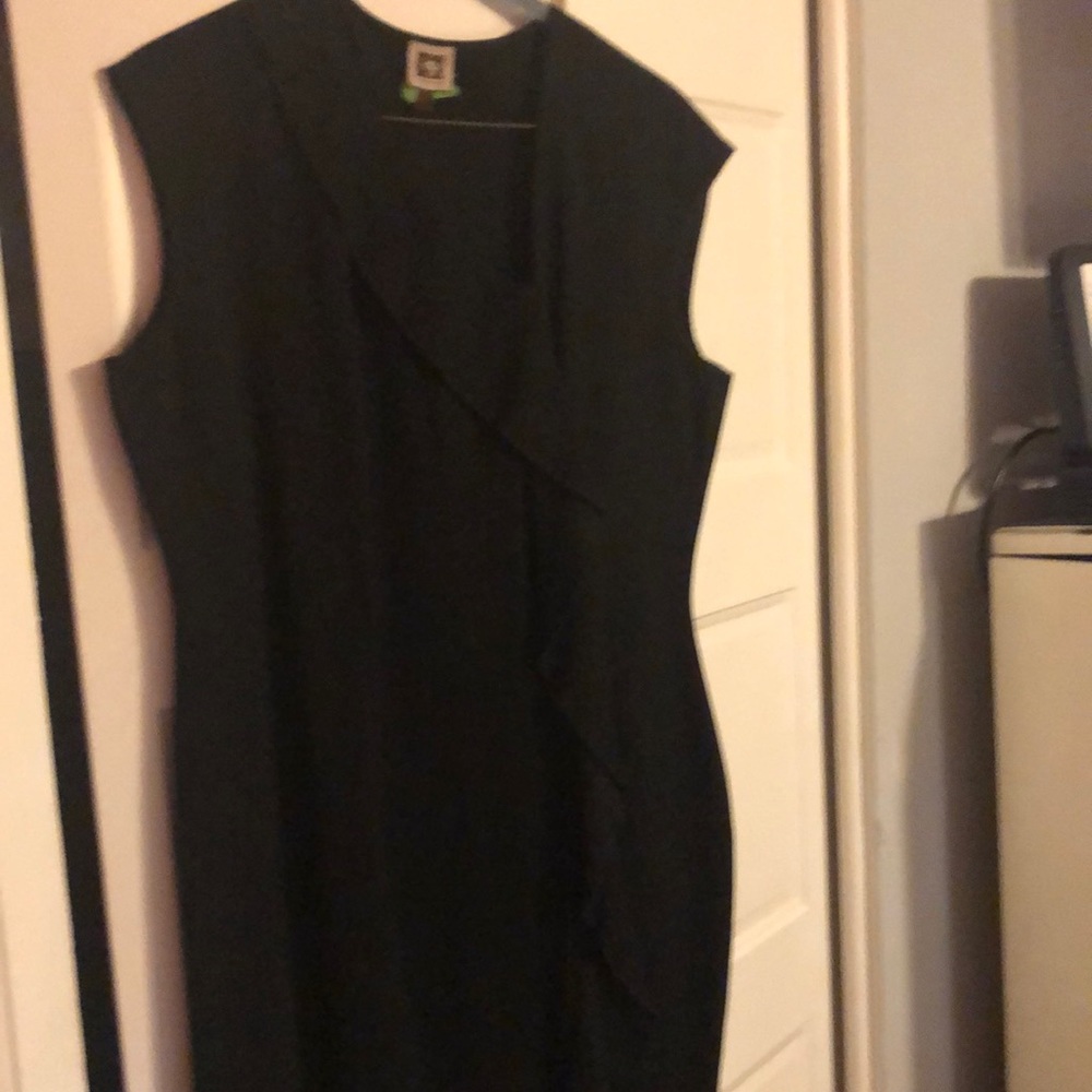 Black Anne Klein classic yet sassy dress with front ruffles.